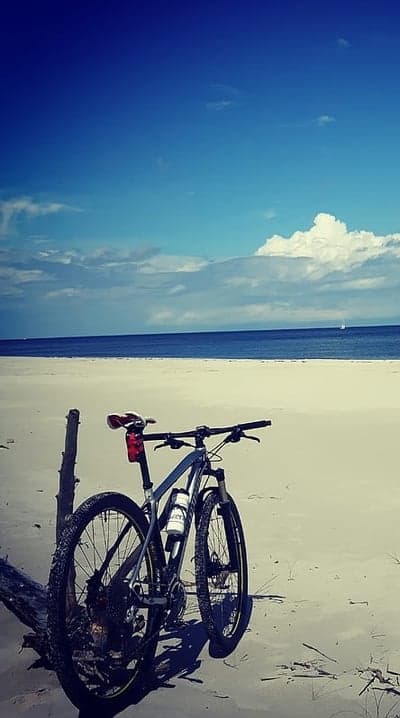 Mountain Bike on a Sandy Beach Facing the Ocean