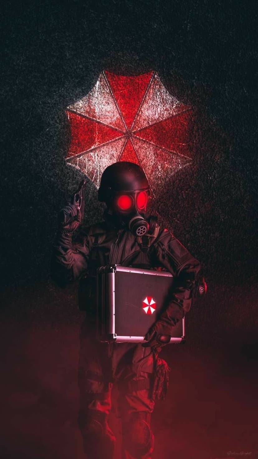 Umbrella soldier in a gas mask with red eyes holds a briefcase and handgun amidst swirling crimson fog.