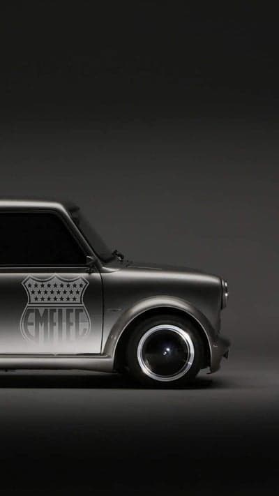 Classic Mini Cooper with "EMFLEC" badge and custom wheels