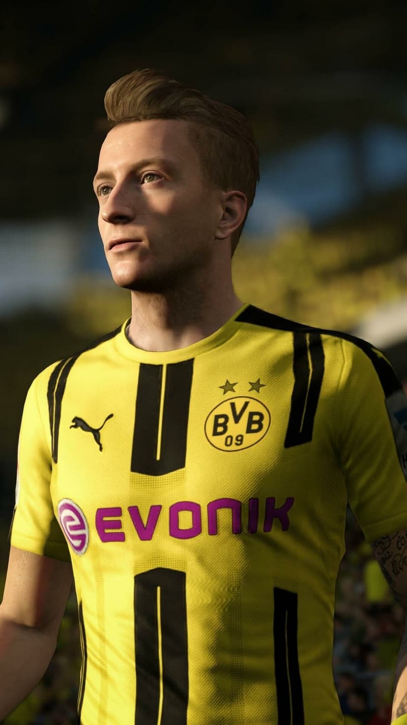 Soccer player Marco Reus in a yellow BVB jersey looking off-camera against a blurred stadium background.