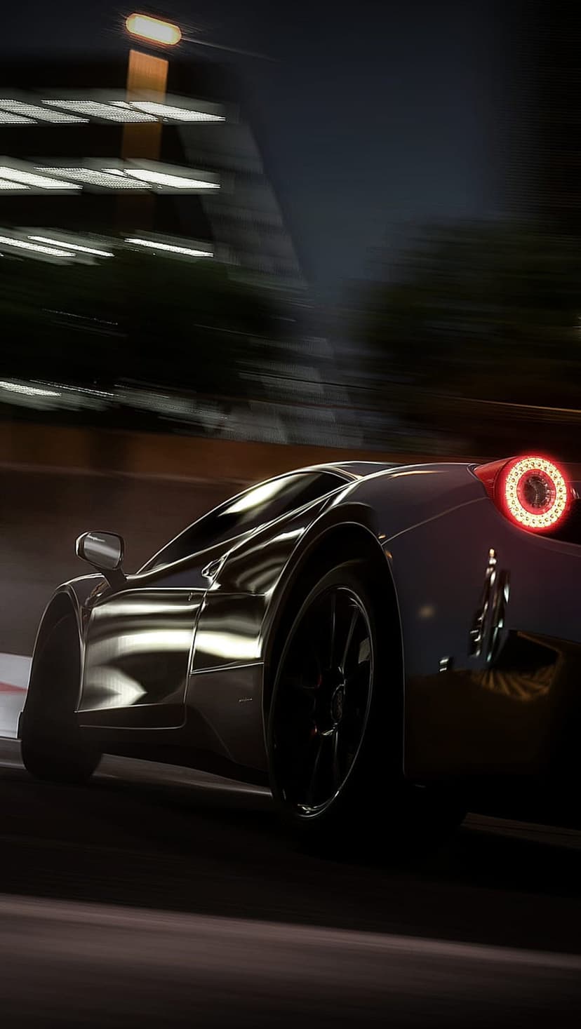 Black sports car accelerating on a dark track with a red taillight streak and motion blur on wet asphalt.