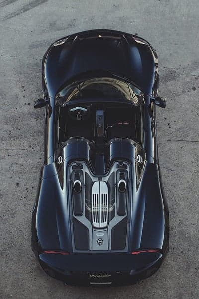 Top View Black Porsche 918 Spyder on Concrete