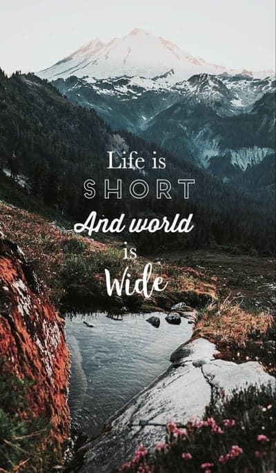 Inspiring mountain landscape with quote: "Life is short and world is wide"