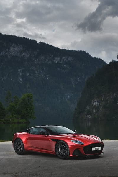 Red Aston Martin DBS Superleggera Alpine Lake Background