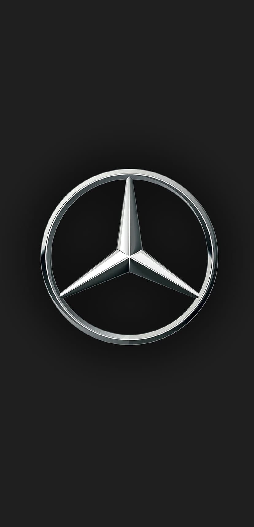Mercedes-Benz three-pointed star logo in polished silver chrome centered on a dark black textured background.