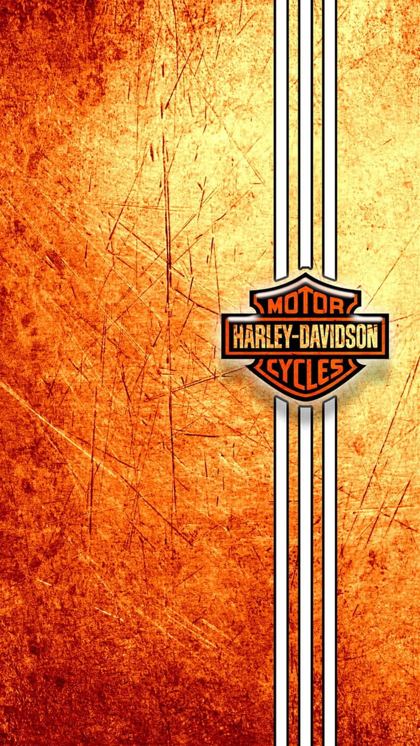 Harley-Davidson Bar and Shield logo centered on a scratched orange surface with three white vertical stripes.