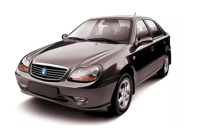 Dark grey sedan with chrome grille and metallic finish parked on a white studio background under soft lighting.