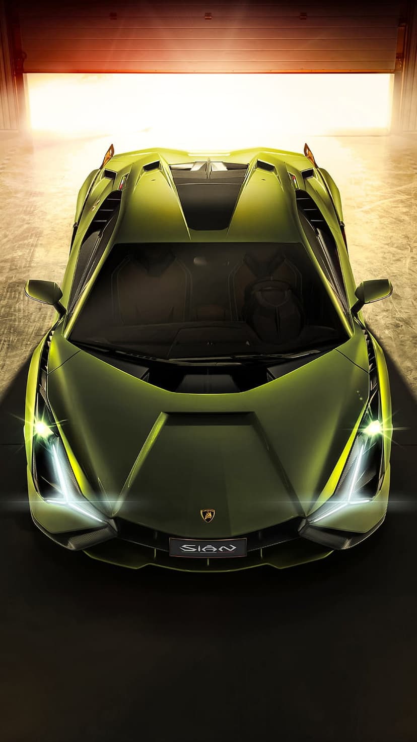 Lime green Lamborghini Sian FKP 37 parked in a garage seen from an overhead view with bright light on the hood.