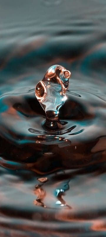 Abstract Water Drop Sculpture on Rippling Surface