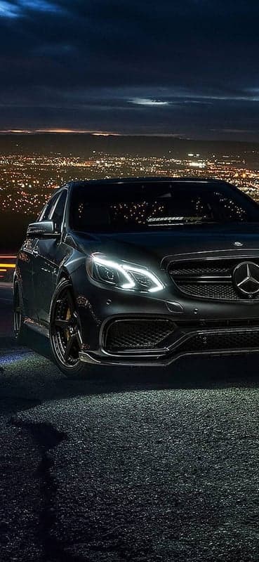 Dark Mercedes Benz E-Class at Night Cityscape