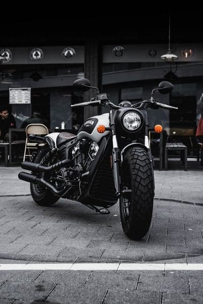 Indian Scout Motorcycle parked outside cafe