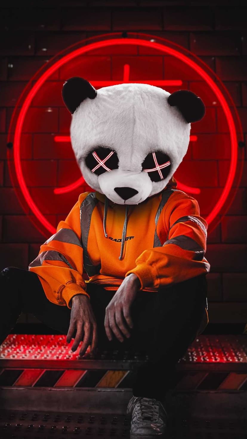 Panda mask with glowing X eyes sits against a brick wall under a red neon sign in a dark urban environment.