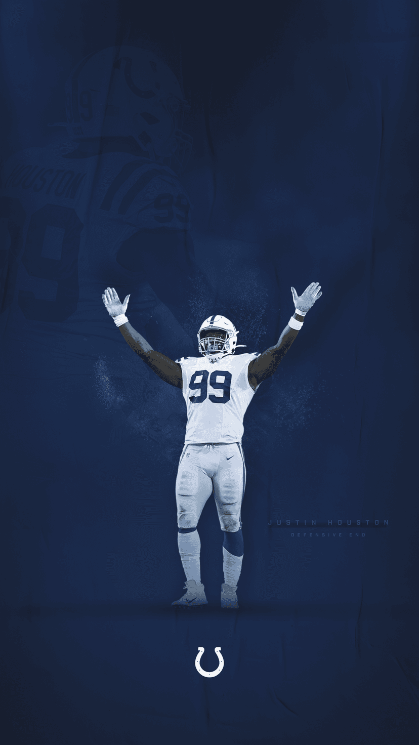 Justin Houston raises his arms in victory wearing a white number 99 Indianapolis Colts jersey against blue tones.