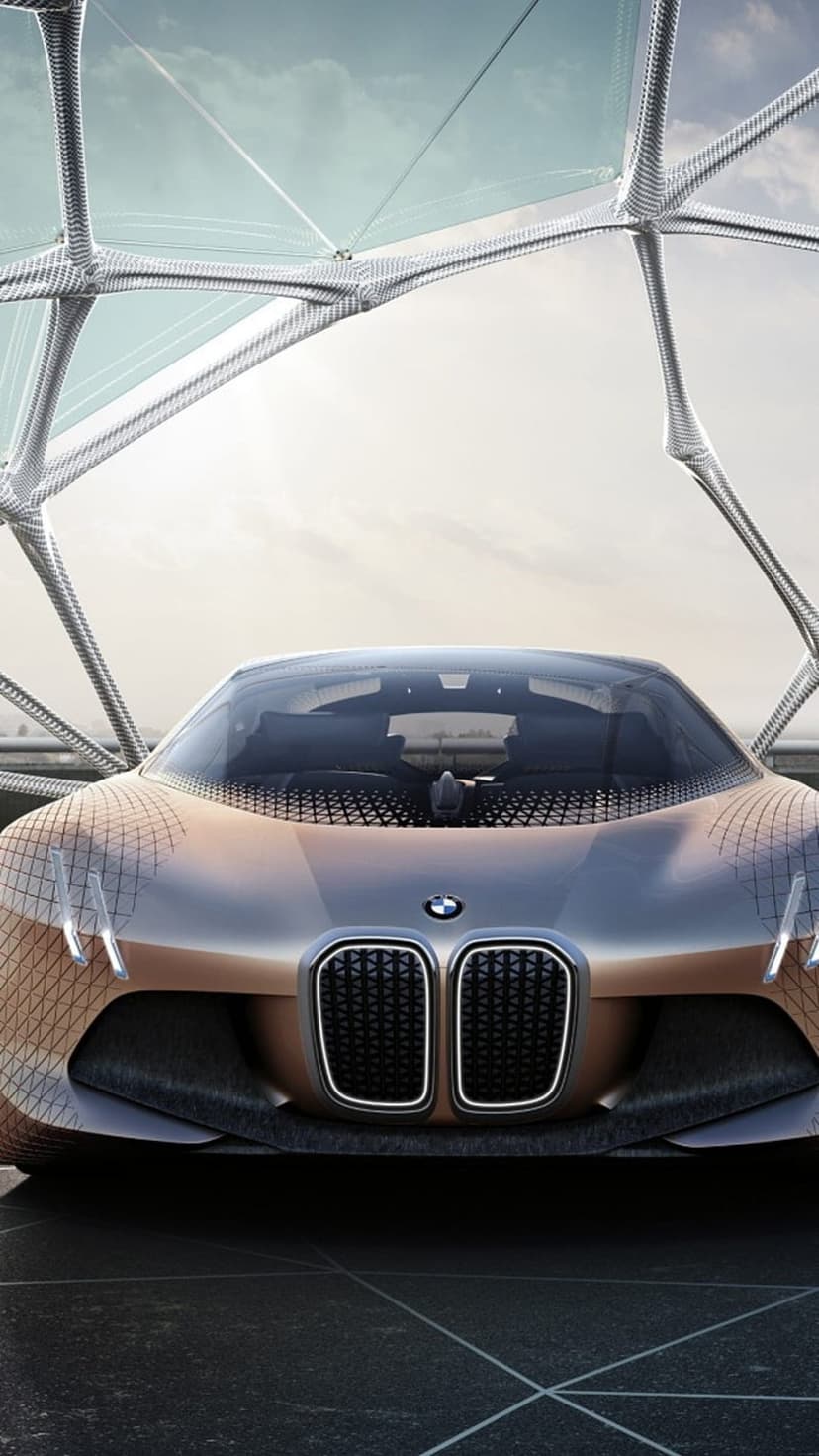 BMW Vision Next 100 concept car features a bronze metallic body and scale-like skin over the front wheels.