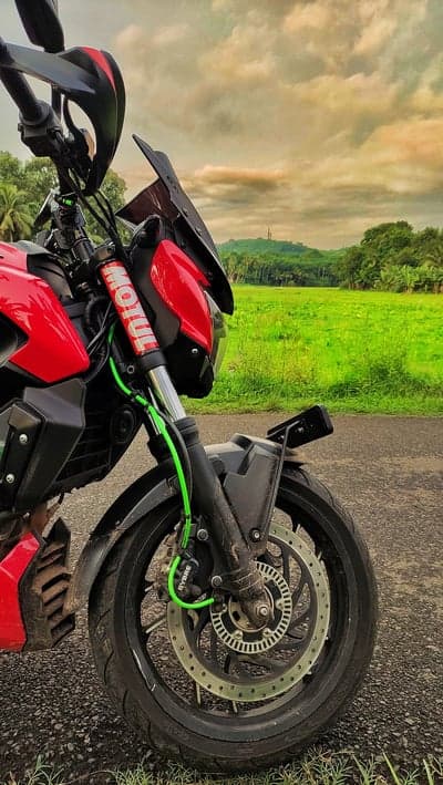 Red Sportbike Wheel and Lush Countryside Mobile Wallpaper