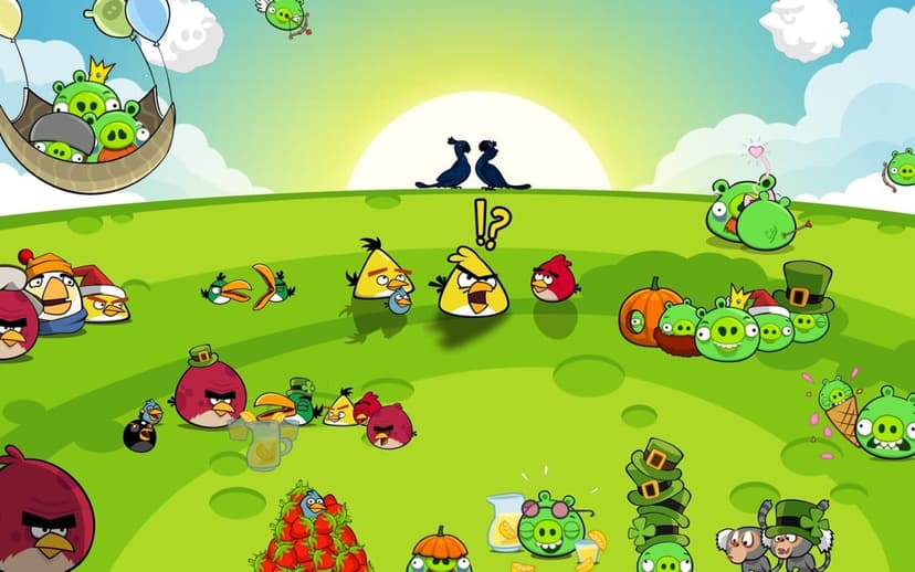 Angry Birds and Pigs characters gather on a green hill under a bright sun in a colorful cartoon landscape.