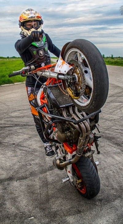 Extreme Motorbike Wheelie Action Mobile Phone Wallpaper