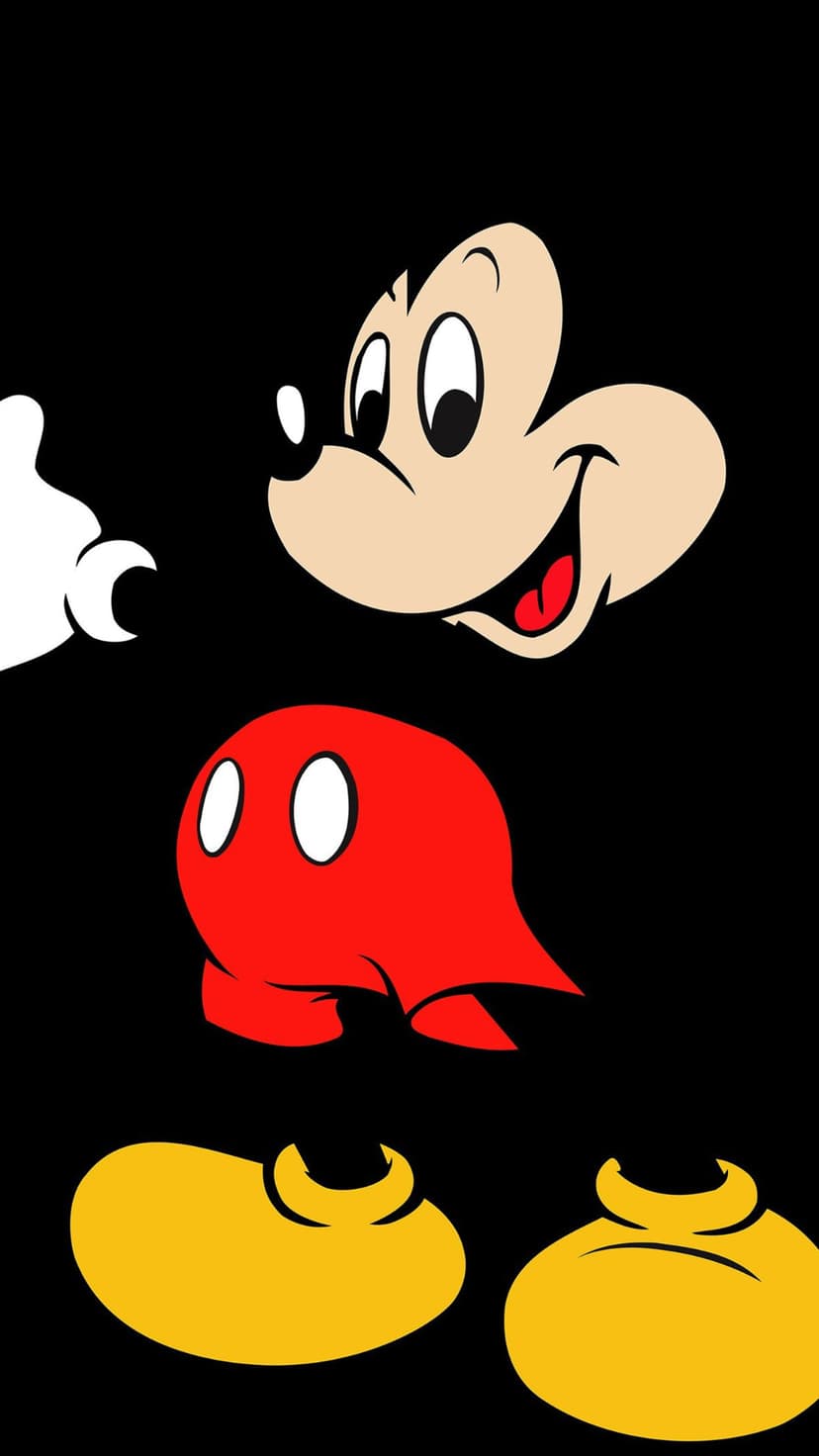 Mickey Mouse stands in a full-body minimalist pose with white gloves and yellow shoes against a black background.