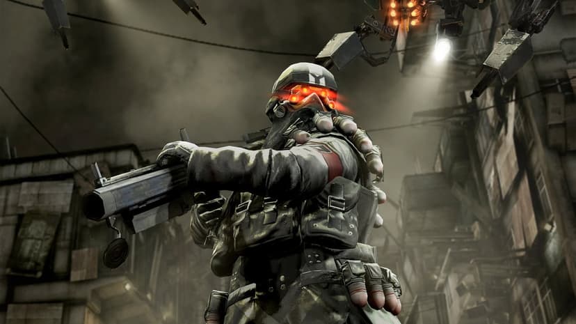 Helghast soldier with glowing red goggles holding a heavy rifle in a ruined, dusty city with a flying drone.