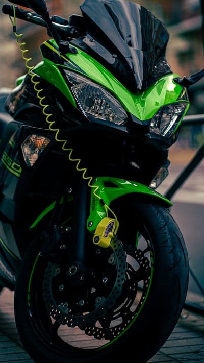 Green Kawasaki Motorcycle with Disc Lock