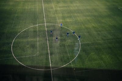Aerial view of soccer players on a grassy field