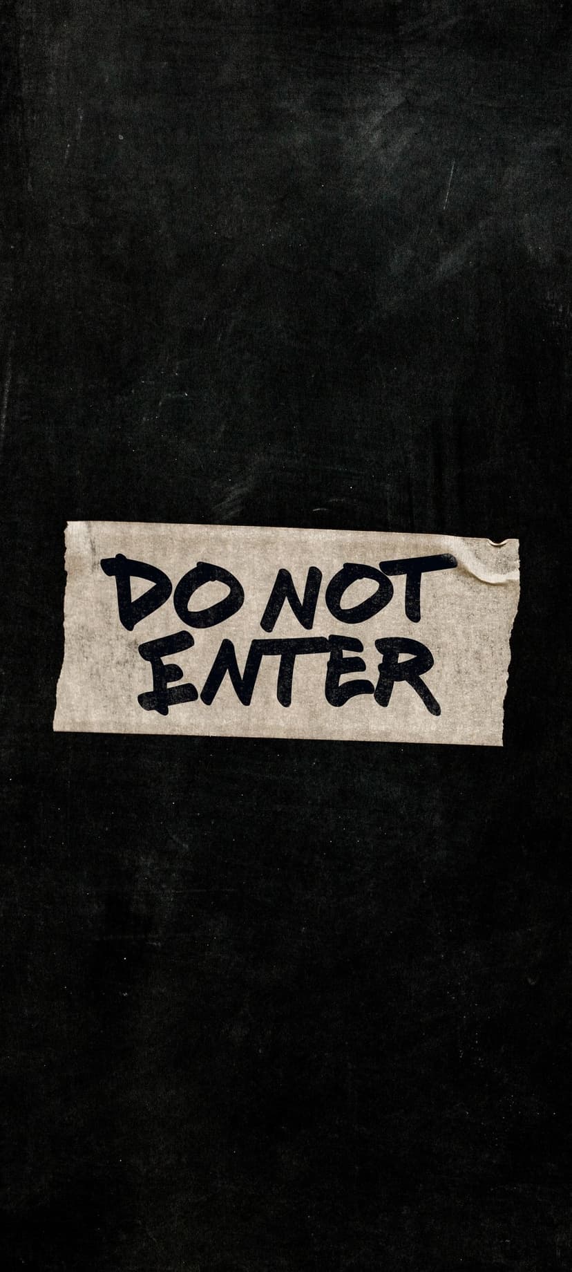 Do Not Enter sign handwritten on white tape centered on a dark textured black background with gritty details.