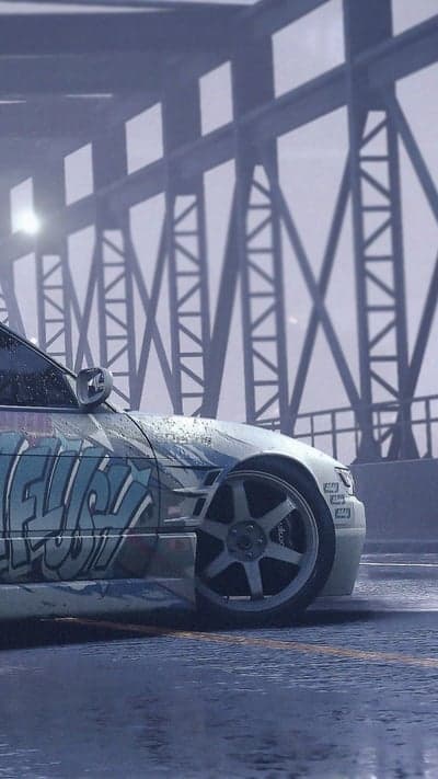 Graffiti car under a bridge, rainy day aesthetic