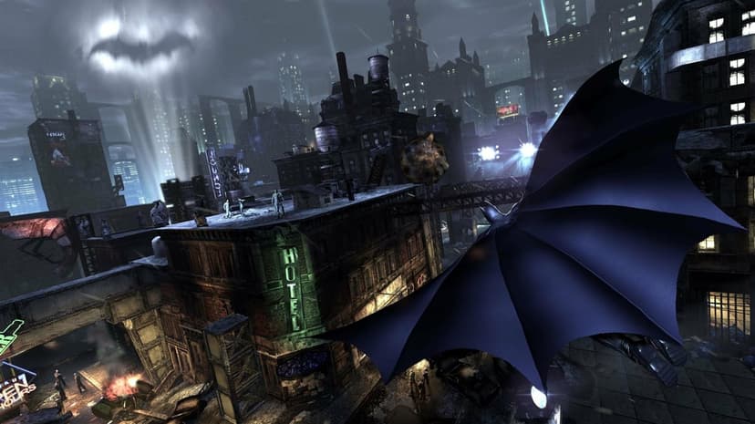 Batman gliding with his cape spread over the dark buildings of Gotham City under a cloudy moonlit night sky.