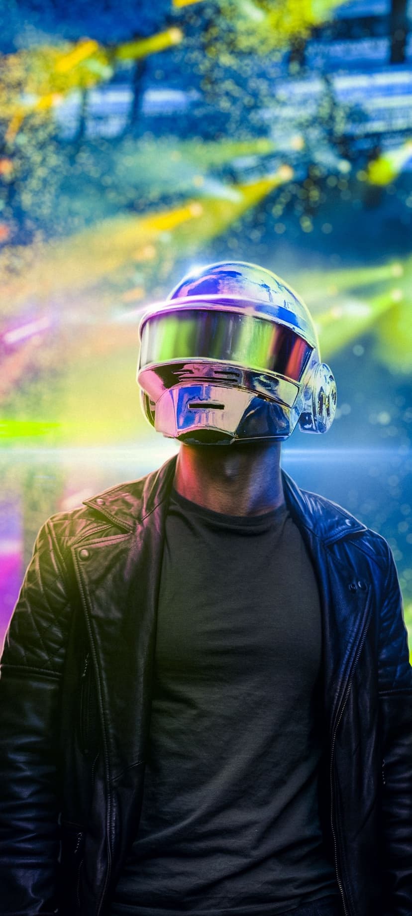 Metallic Daft Punk style helmet reflects blue and yellow lights above a black leather jacket in a vertical shot.