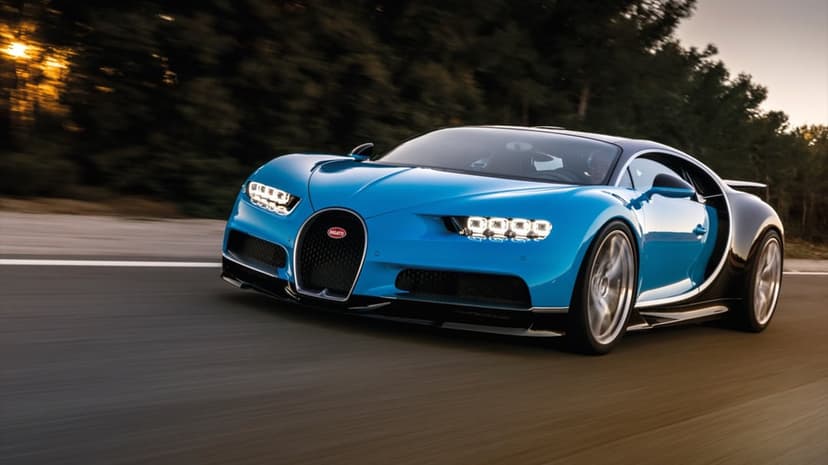 Blue Bugatti Chiron hypercar driving fast on a road with motion blur and warm sunset lighting.