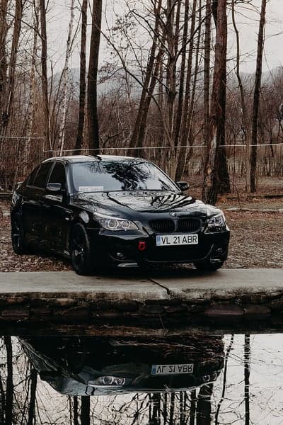 Midnight Black BMW Sedan Forest Lake Mobile Backdrop