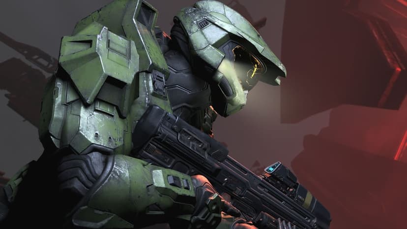 Master Chief in green battle-worn armor holds a rifle against a dark red backdrop with a glowing golden visor.
