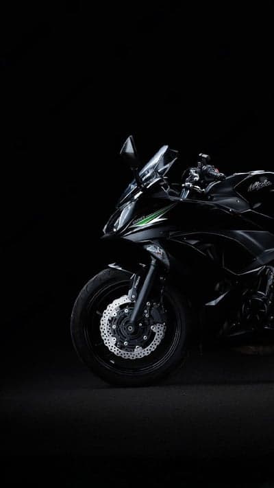 Sleek Black Ninja Motorcycle on Dark Background