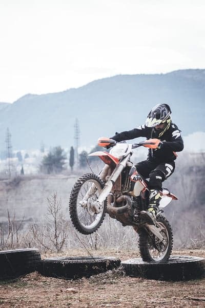 Dirt Bike Rider Mid-Air Leap Motocross Phone Wallpaper