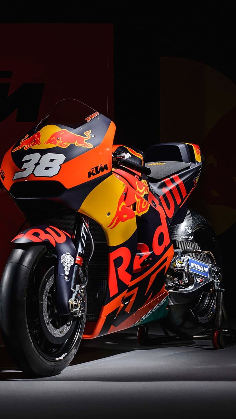KTM RC16 MotoGP motorcycle with number 38 and Red Bull graphics in a front-three-quarter racing perspective.