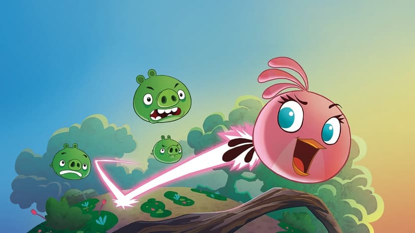Pink bird Stella flies through a cartoon jungle with green pigs and a pink energy trail under a blue sky.