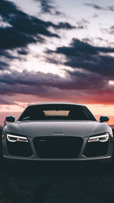 Audi R8 Front View at Sunset with Dramatic Clouds