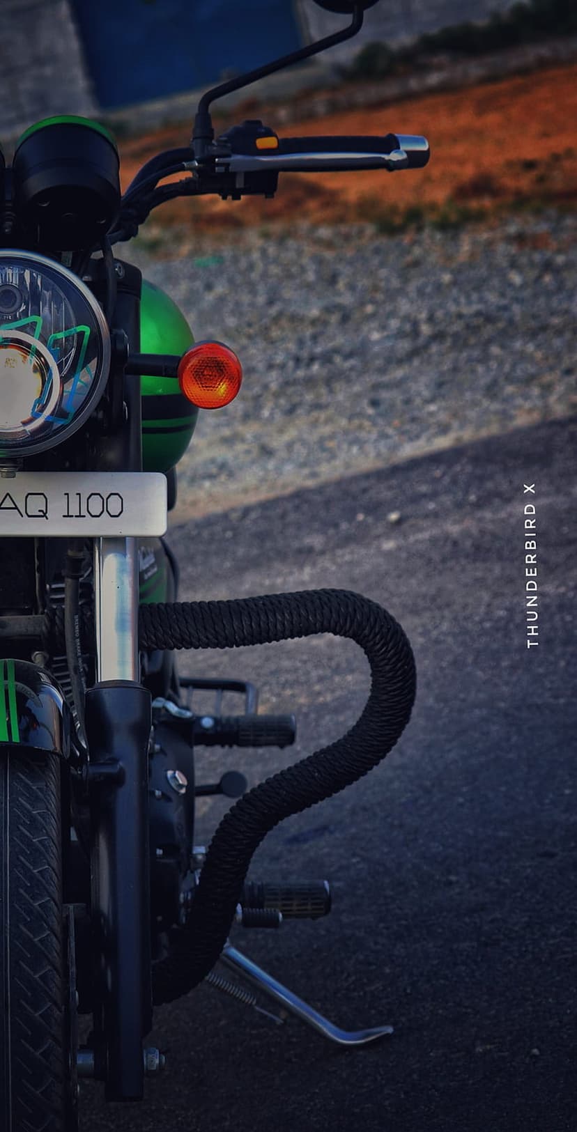 Royal Enfield Thunderbird 350X front view featuring a round headlight, green paint, and black engine guard.