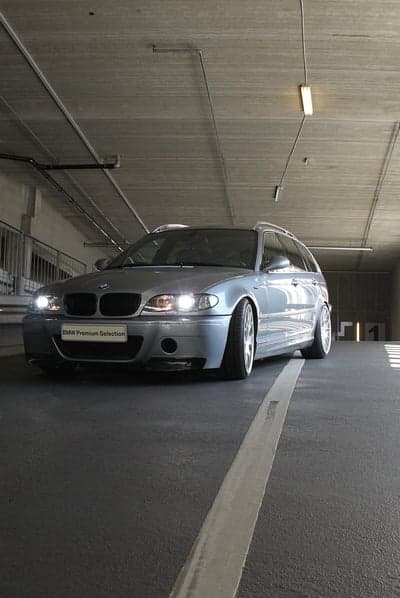 Silver BMW Touring Mobile Wallpaper in Industrial Garage