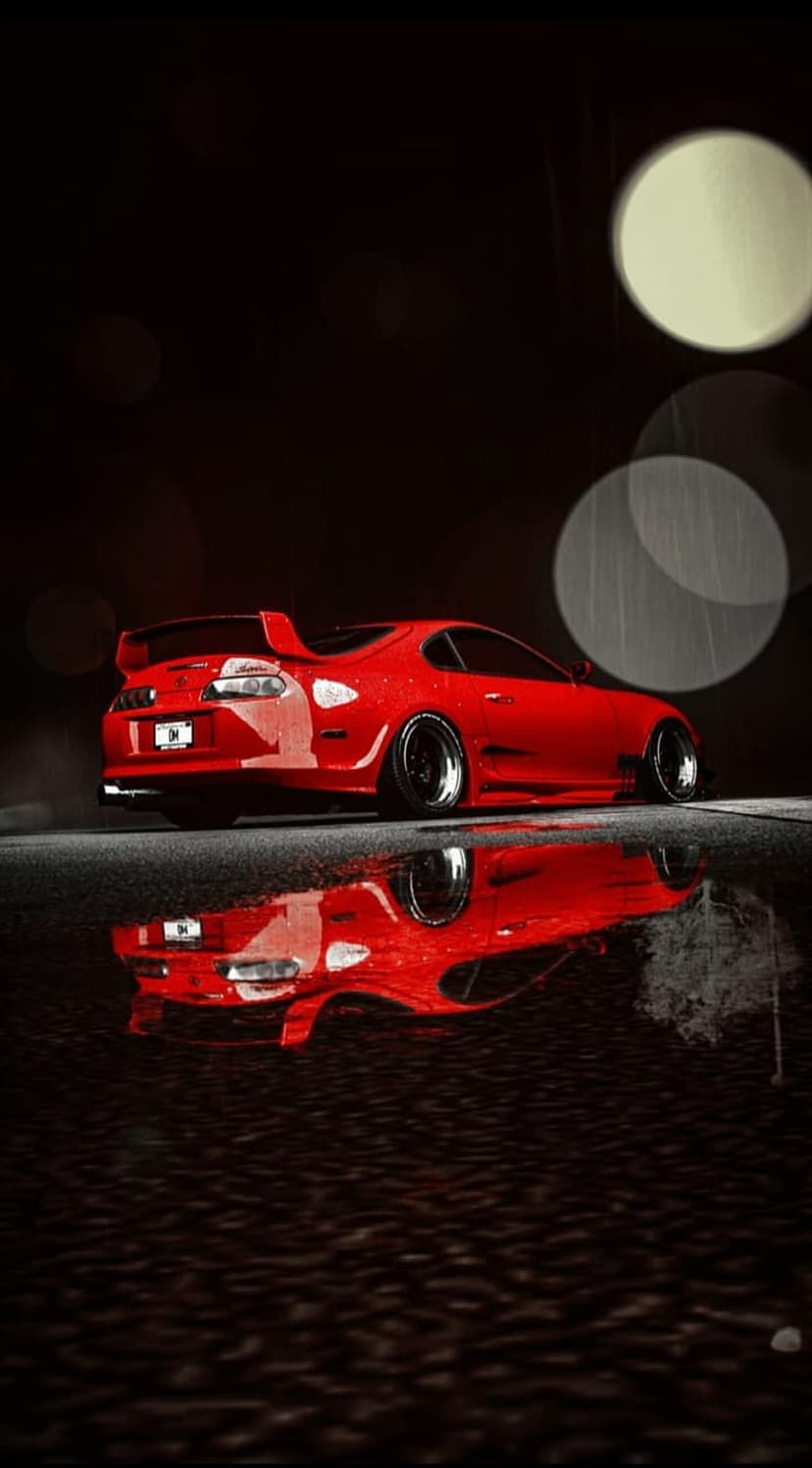 Red Toyota Supra sports car parked on a wet night street with blurred bokeh lights and reflections in puddles.