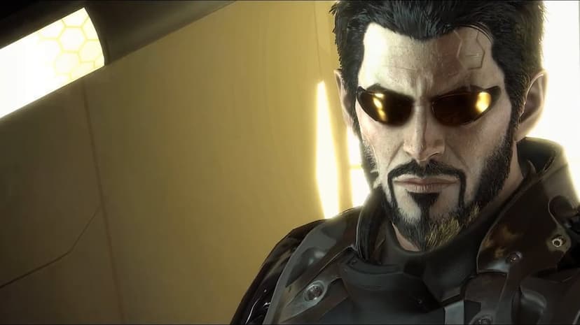 Adam Jensen with gold augmented sunglasses and cybernetic facial details in a warm golden cinematic environment.