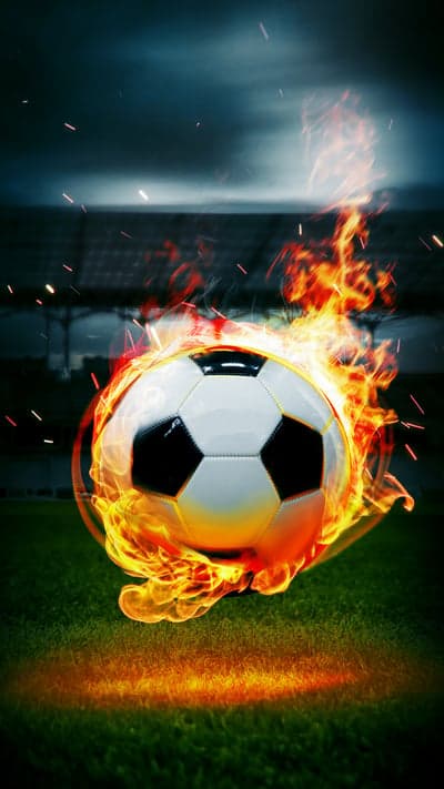 Soccer Ball on Fire on a Dark Football Field