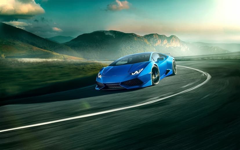 Blue Lamborghini Huracán speeding through a mountain curve with motion blur on the road under a cinematic sky.