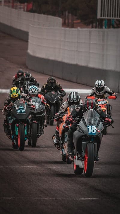 Motorcycle Race on Track with Riders in Full Gear