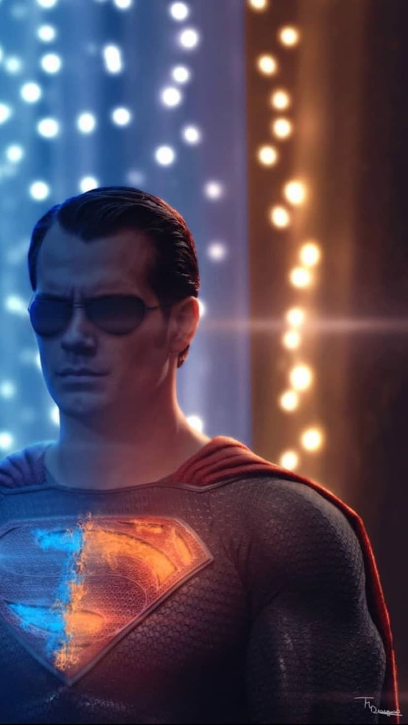 Superman in aviator sunglasses with a split blue and orange glowing chest emblem against a bokeh background.