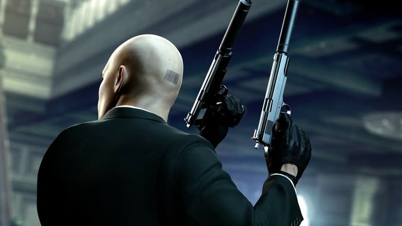 Agent 47 from behind holding two silenced pistols, revealing his barcode tattoo and sleek black suit.