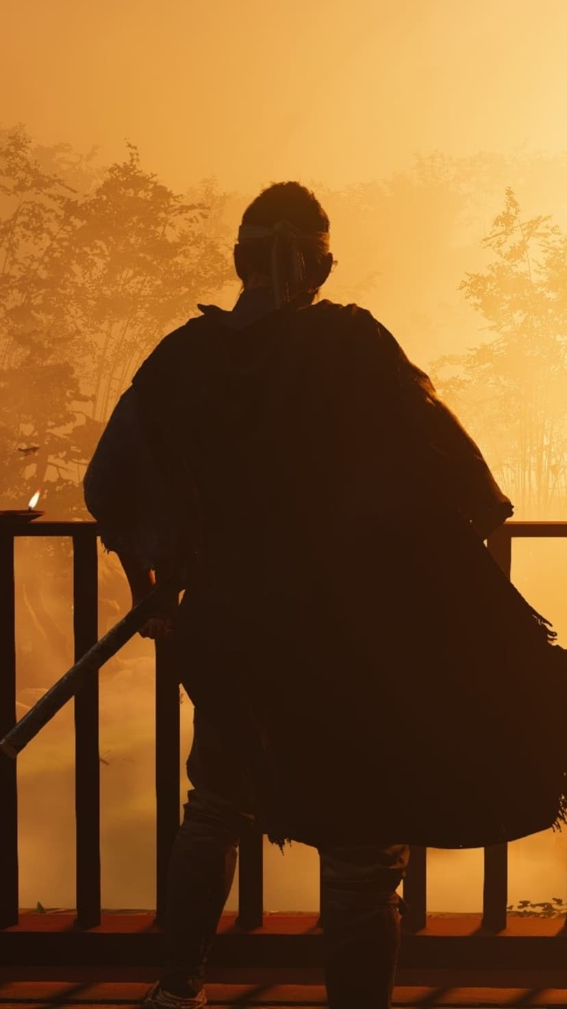 Samurai silhouette on a wooden bridge facing a misty golden sunrise while holding a katana in a vertical view.