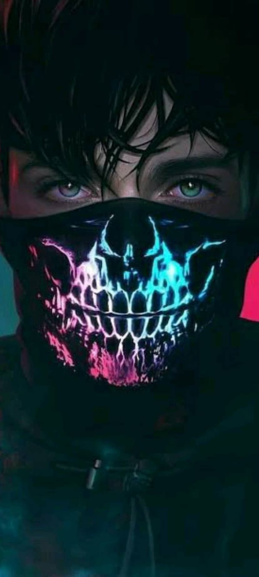 Man wearing a neon pink skull face mask with intense blue-green eyes and dark messy hair against a dark background.