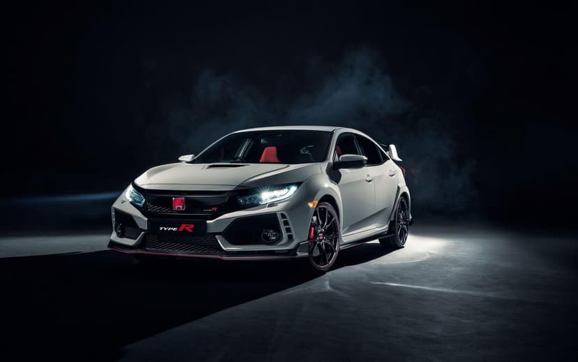 White Honda Civic Type R in a dark studio with dramatic lighting, red accents, and subtle smoke trails.