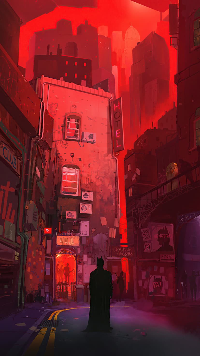 Batman stands in a dark alleyway illuminated by red neon signs and glowing hotel lights among brick walls.